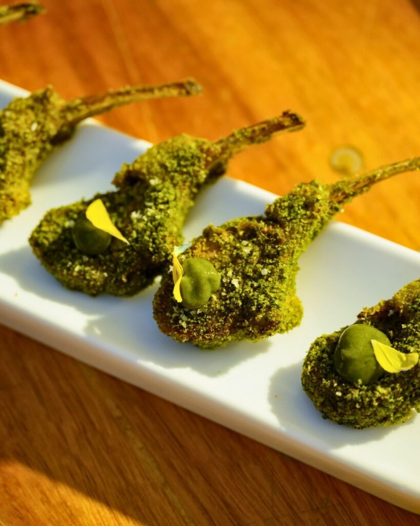 Pistachio-crusted lamb chops served at tropical garden wedding