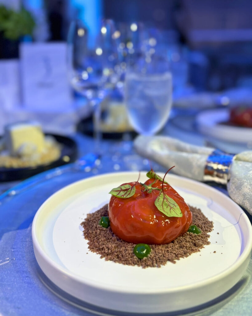 Reconstructed tomato panzanella starter on biscuit crumble at The Bass corporate dinner