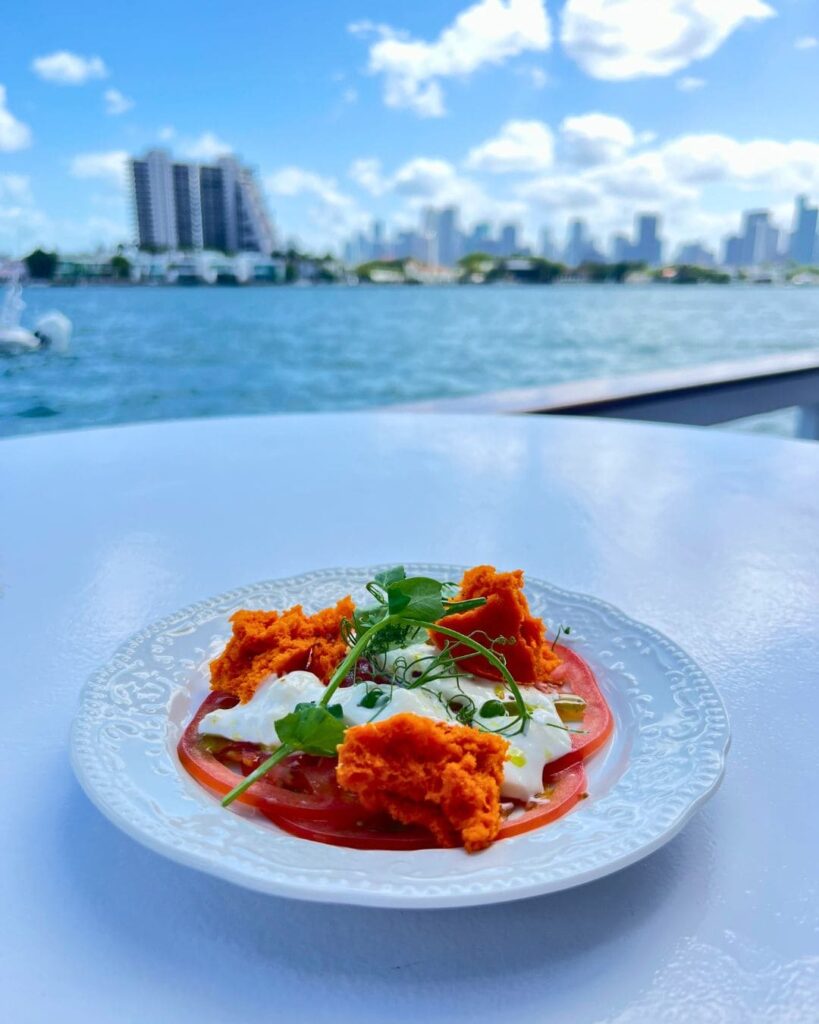 Tomato and burrata salad with bread sponge on The Vessel table