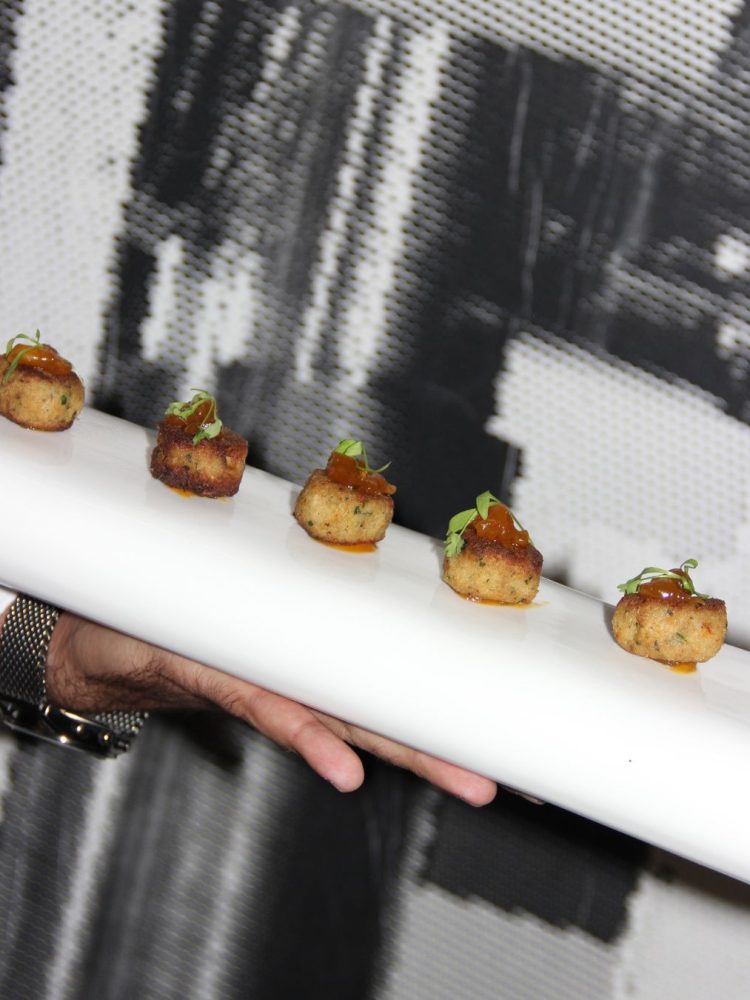 Plate of gourmet hors d’oeuvres served at a catered event.