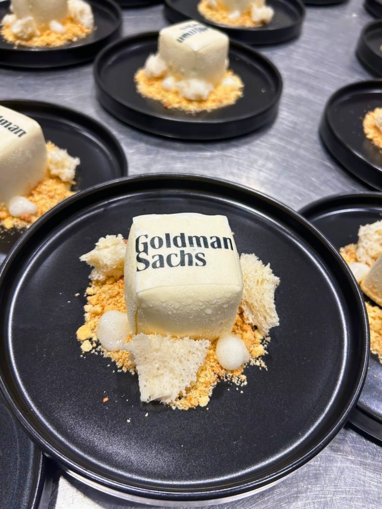 White cube yuzu ganache dessert branded with Goldman Sachs logo